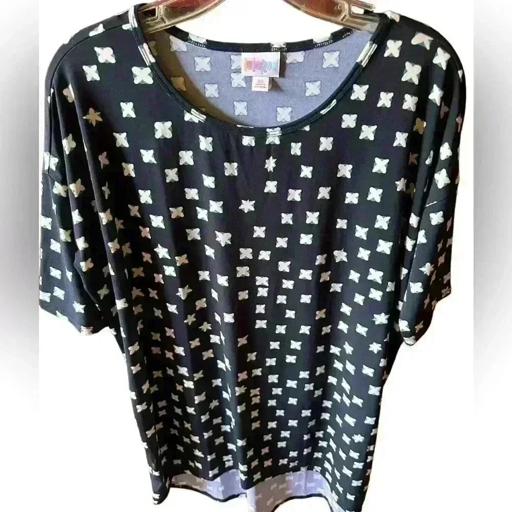 Lularoe XS black Irma tunic length top with cream and teal cross pattern. NWT